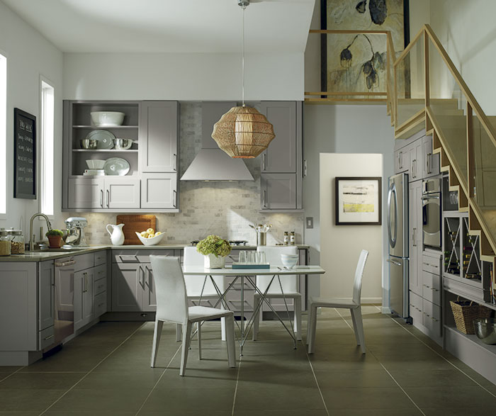Grey cabinets in casual kitchen by Diamond Cabientry