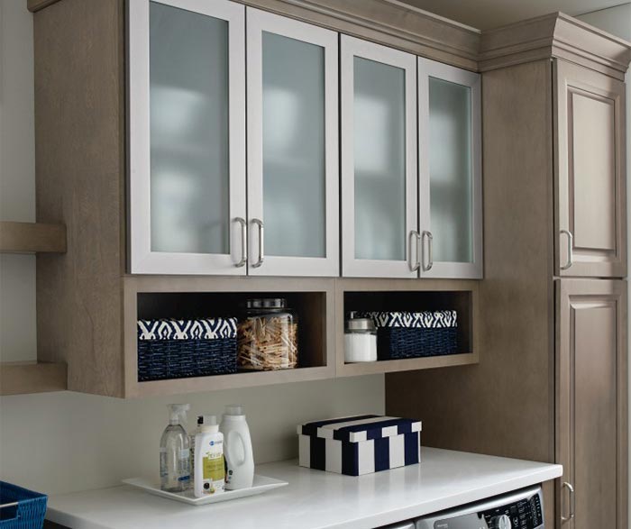 Close up of aluminum frame cabinet doors in laundry room