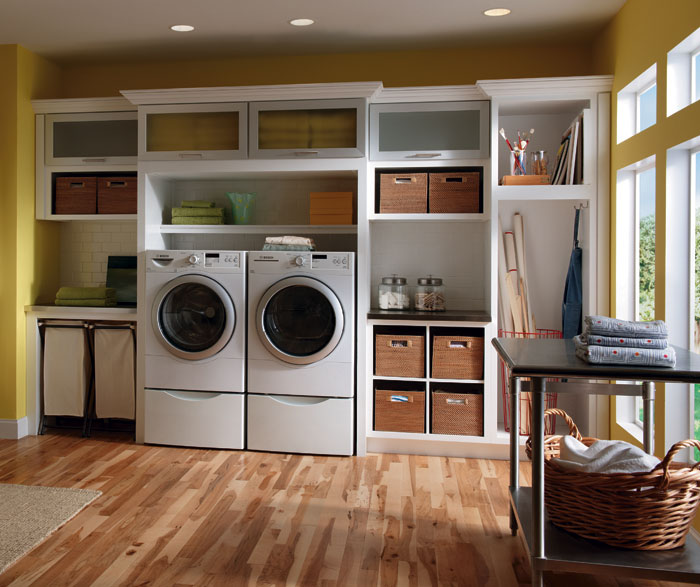 Laundry room cabinets in painted white maple by Diamond Cabinetry 
