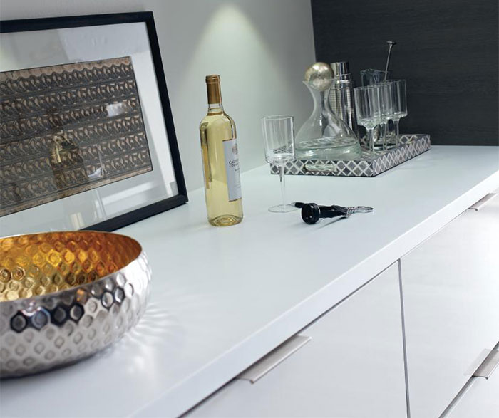A countertop with a contemporary laminate kitchen cabinet next to it.